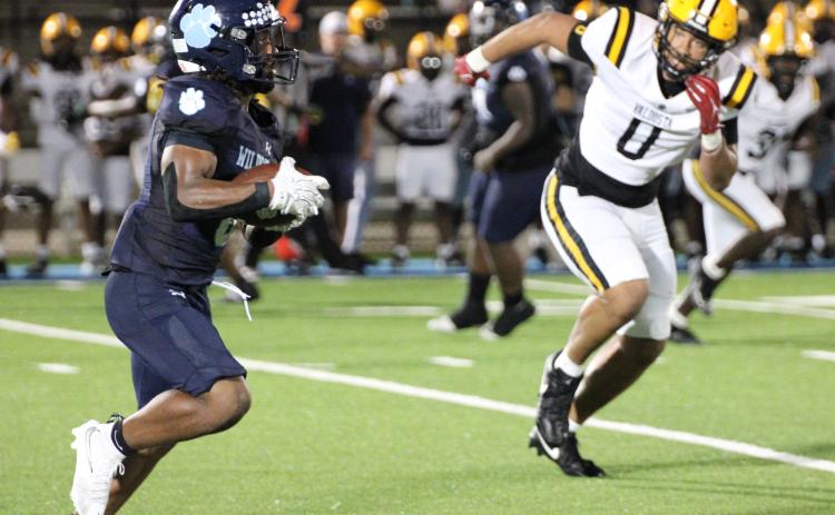 Camden County running back Julian Dailey looks for running room after catching a screen pass from William Jackson on Friday.