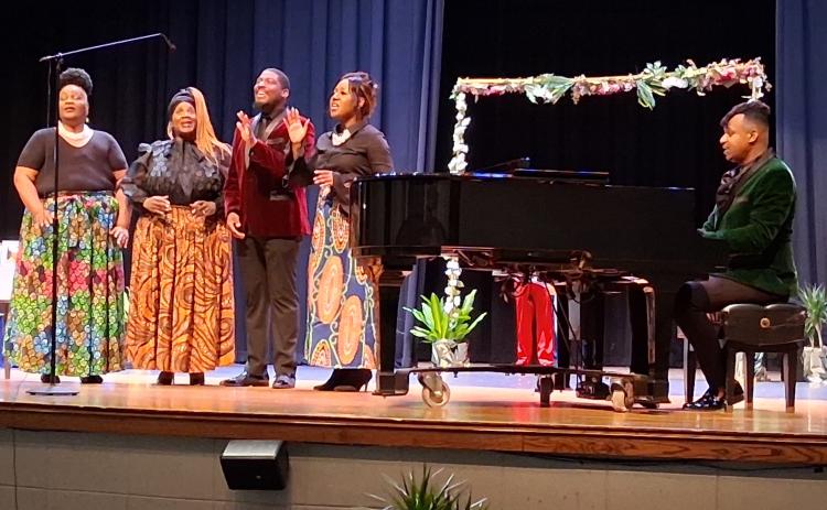 The Duke Fisher Singers perform Tuesday morning during a Thiokol plant explosion memorial at Camden County High School’s auditorium.