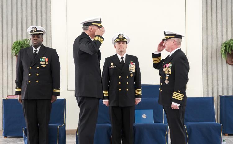 Capt. Bradley Bozin, left, incoming commanding officer at Trident Training Facility Kings Bay; Capt. Matthew Fanning, center, commanding officer, Submarine Learning Center and presiding officer; and Capt. Brian Turney, outgoing commanding officer of Trident Training Facility Kings Bay, participated March 12 in a change-of-command ceremony at Naval Submarine Base Kings Bay.