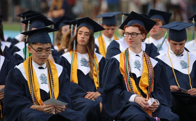 Camden County High School graduates listen to speeches during the school’s commencement exercises Friday night.