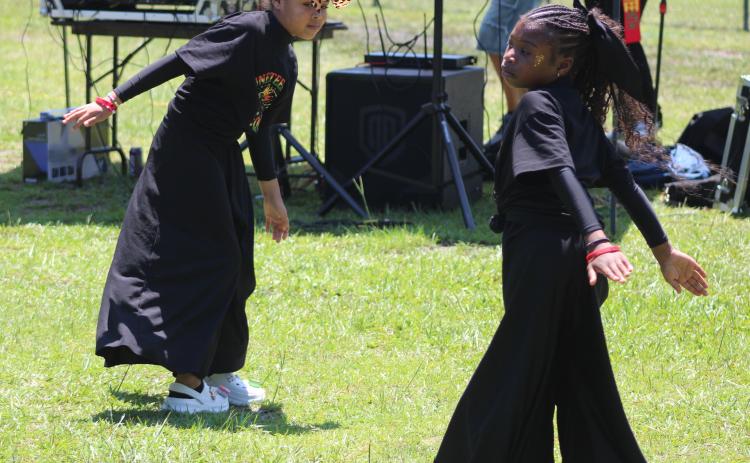 Jhianna Patterson and Autumn Fizer dance Saturday during the annual Juneteenth Jubilee in Woodbine. The celebration is hosted each year by the Camden County NAACP branch. To view more photos from the event, visit tribune-georgian.smugmug.com/Juneteenth-Jubilee-2026.