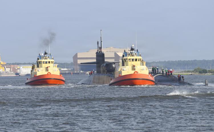 The Ohio-class guided-missile submarine USS Georgia transits the East River on Monday as she returns to her homeport at Naval Submarine Base Kings Bay.