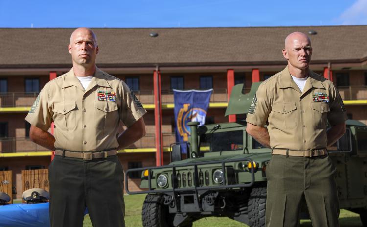 Marine Corps Security Force Battalion (MCSFBn) Kings Bay, newly pinned sailors and Marines stand at attention during a Chief Petty Officer pinning ceremony at MCSFBn Headquarters on Naval Submarine Base Kings Bay.