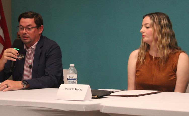 St. Marys Councilman Chad Ingram, left, and challenger Amanda Moore discuss city issues during the Tribune & Georgian’s candidate forum Tuesday. The two are running for the Post 3 seat on Council.