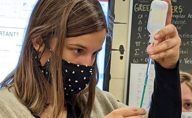 Fernandina Beach High School student Sarah Perkins uses a pipette to collect water for analyzing. Fernandina Beach High School students prepare biological slides that are ready to be put in the incubator overnight. KENDRA SHAFER/FOR THE NEWS-LEADER