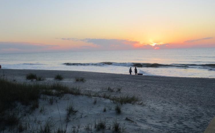 People were on the beach at sunrise when the city of Fernandina Beach reopened its shoreline Monday, May 4. Social distancing is required, but there are no restrictions on open hours or activities on the city’s beaches. Beachgoers were observed following the guidelines put in place to avoid spreading the novel coronavirus. Nassau County’s beaches from Peters Point to Amelia Island State Park are open from 6 a.m. until 9 p.m. daily with no group sports allowed. JULIA ROBERTS/NEWS-LEADER