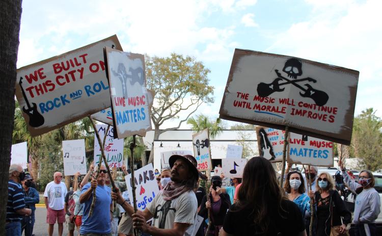 A crowd gathered outside Fernandina Beach City Hall on Tuesday to show city commissioners they want changes made to the city’s noise ordinance that would allow venues to continue to feature live music.