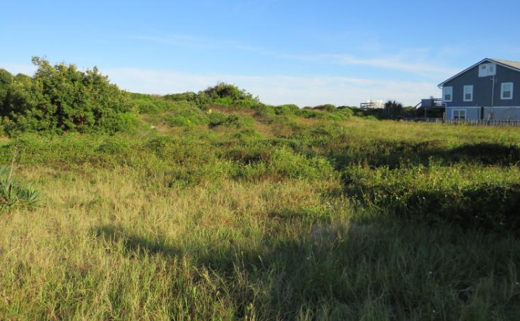 Two separate but adjoining hotels could be built on these two beachfront lots just north of Sliders Seaside Grill on South Fletcher Avenue. JULIA ROBERTS/NEWS-LEADER