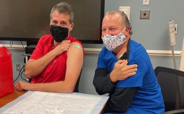 Dr. Alan Miller and physician assistant Keith Rawlinson, both with Coastal Spine and Pain Center, have received a first dose of the coronavirus vaccine. An additional vaccination will be administered 17 to 21 days after the first dose, and immunity takes at least seven days to take effect. ALAN MILLER