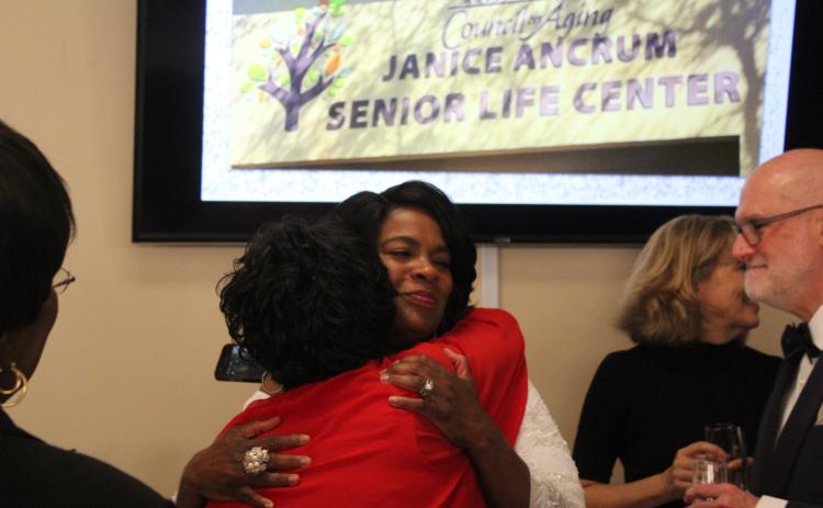 Janice Ancrum hugs her best friend of 35 years, Shirley Moore.