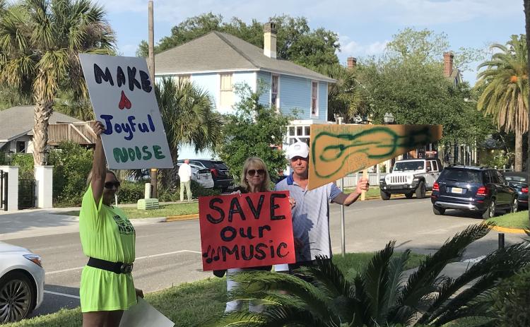 A few protestors appeared outside Fernandina Beach City Hall in support of the local live music scene, but were gone by the time the matter was discussed by the City Commission.