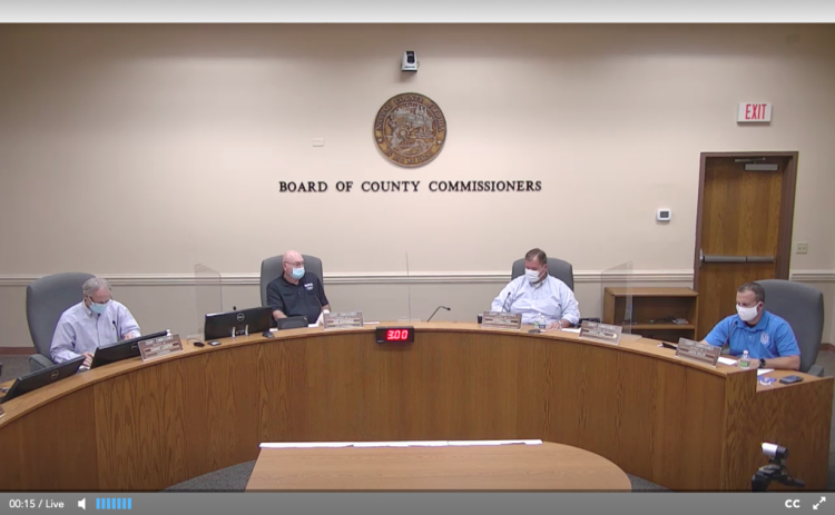 Four members of the Nassau County Board of County Commissioners wear masks Wednesday for their special meeting. Commissioner Aaron Bell attended via videoconferencing. NASSAU COUNTY