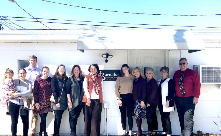 Several people join together to celebrate the opening of Barnabas’ new service center in Callahan, which is open by appointment to assist local residents. Call 904-261-7000 for assistance.
