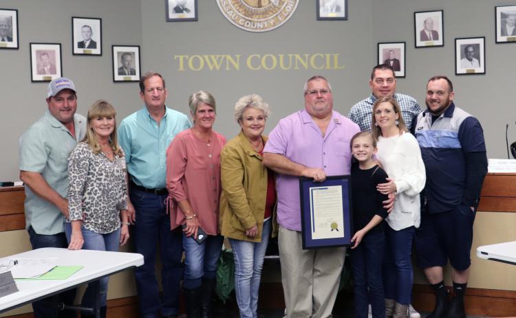 Hilliard Town Council President John Beasley is joined by family after receiving recognition for 20 years of service to the town.
