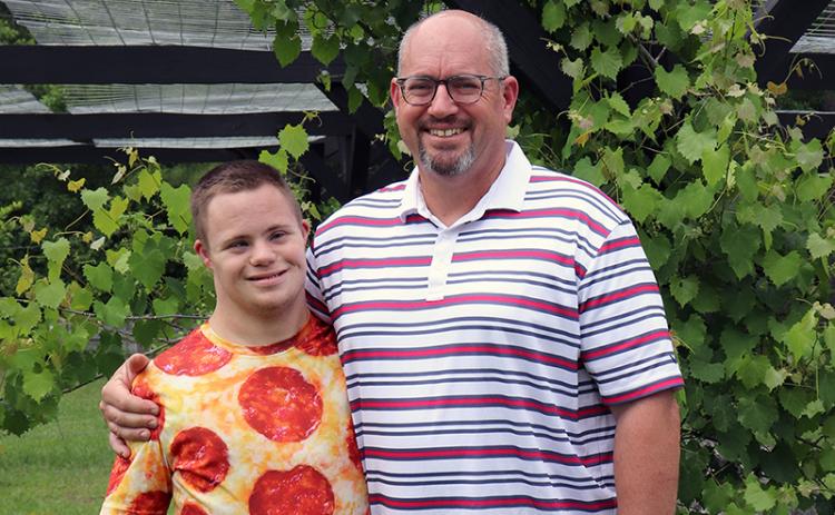 West Nassau High School junior Max Lucovsky joins his dad, Jeff, in their backyard. The teen turns 18 Saturday. Photo by Kathie Colgrove