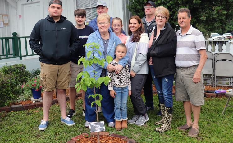 The family of West Nassau Historical Society co-founder Jan Johannes gathers around a dogwood tree planted in his memory during the society’s 16th annual Railroad Day Festival April 17.