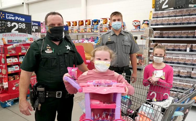 Deputies, Explorers and other members of the Nassau County Sheriff’s Office and various state agencies shop with 333 children during Nassau’s annual Shop with a Cop event. Children are identified based on need and then pair up with officers to shop for clothing, shoes and toys.