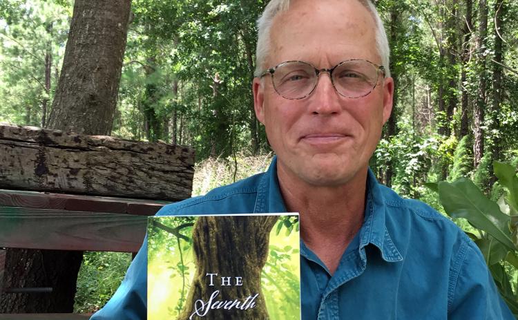Mike “MJ” Gaylor showcases his novel. He will have a booth at the Callahan Community Market Saturday, 10 a.m. to 2 p.m. at the Callahan Depot. Photo by Lorelai Bryan Photography
