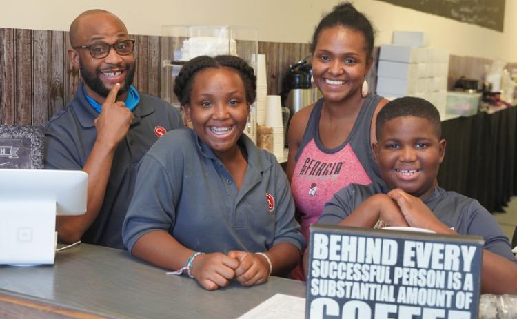 Joe and Jennifer Timmon, the proprietors of Southern Blend, with daughter Jerea and son Josiah. GARY MORGAN/FOR THE NEWS-LEADER
