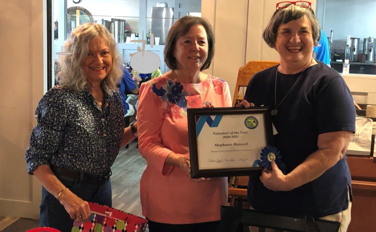 Nassau County Retired Educators Association Volunteer Coordinators Elaine Rafter, from left, and Barbara Leech present the Volunteer of the Year Award to Stephanie Manwell for outstanding service to the community.