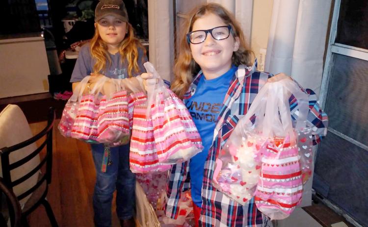 Junior Be The Change Northeast Florida volunteers prepare Valentine’s Day care packages to distribute to the homeless. The non-profit always accepts volunteers to assist with its efforts. Visit https://www.facebook.com/Be-the-Change-NE-Florida-Inc-280042779206525 to learn more.