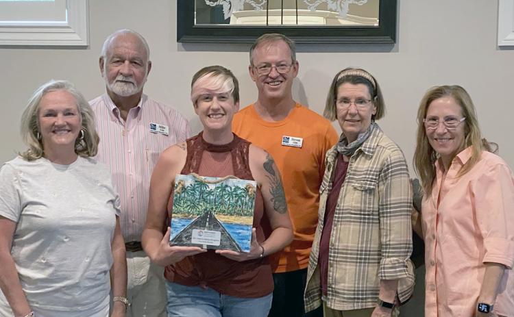 Keep Nassau Beautiful board members and staff celebrate their award, including Lynda Bell, Mike Cole, Jules Ruppel, Steven Gibb, Kelley McCarter and Jean Mauldin.