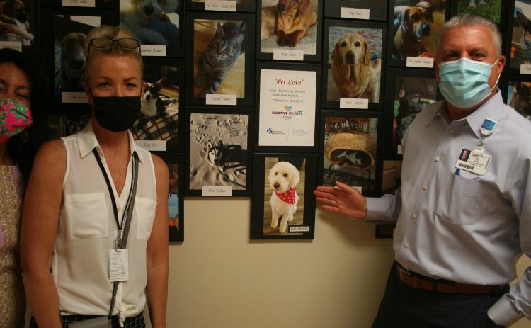 Baptist Medical Center Nassau President Ed Hubel, right, and his dog, Lilly.