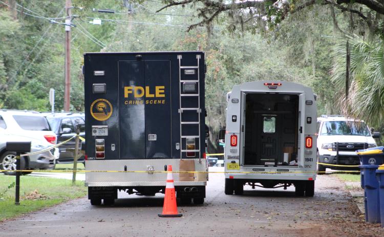 Fernandina Beach Police Department and Florida Department of Law Enforcement officials at the scene of a homicide Monday on S. 13th St. in Fernandina Beach.