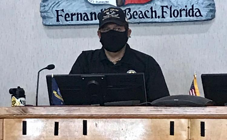 Mayor Johnny Miller of Fernandina Beach wears a mask at a special meeting called Thursday to discuss whether to mandate the wearing of masks in an attempt to slow the spread of the novel coronavirus.  Julia Roberts/News-Leader