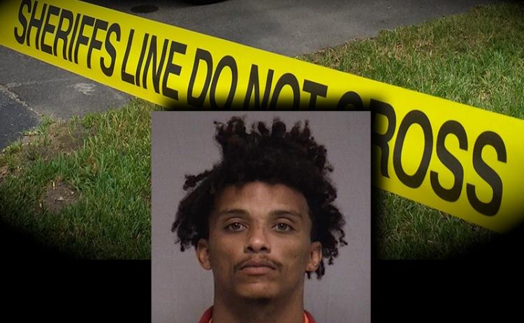 A mugshot of suspect Hicks over crime scene tape. NCSO
