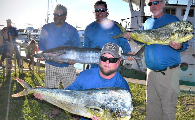 Chris Stephens, Rich Wolford, Bubba Weeks, from left, and Larry Owens, kneeling, teamed up to top some 24 blue water teams during the 26th annual Amelia Island Blue Water Shootout Saturday. TERRY LACOSS/SPECIAL