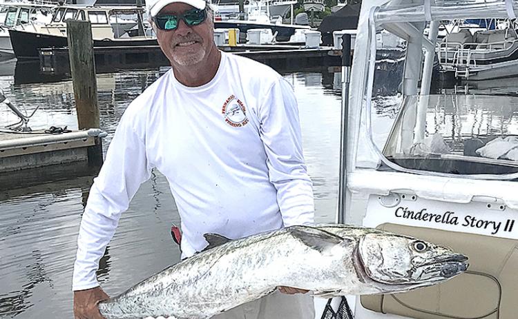 Brad Reese set a new Nassau Sport Fishing Association club record with this 37.12-pound kingfish. SPECIAL PHOTO