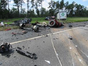 Debris from a Saturday afternoon crash litters the roadway. 