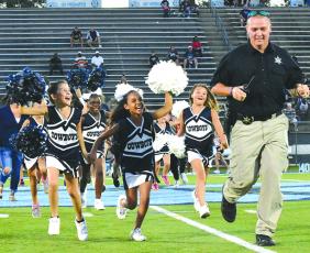 Youth football players, cheerleader and their coaches participate in rec league night at the high school football games. 