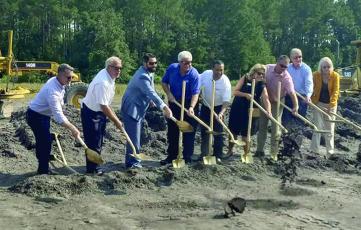 Camden and Plug Power representatives break ground at a ceremony Tuesday at the county industrial park. 