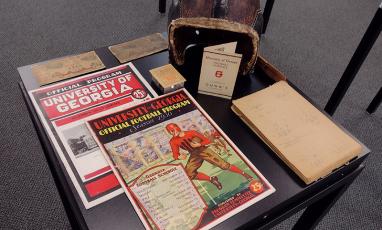 University of Georgia athletics history specialist Jason Hasty brought an exhibit of the school's athletic memorabilia to the St. Marys Library July 27. Among the the treasures were football game programs and ticket stubs dating to the 1920s, including the 1929 UGA-Yale game. (Tribune & Georgian/Andy Diffenderfer)  