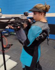 Abigail Swain takes aim in the new rifle facility at Camden County High. The senior earned all-state praise last season as the Wildcats finished second at state. (Andy Diffenderfer, Tribune & Georgian)