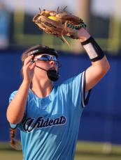 Lady Wildcat infielder Alyssa Jewell snags a pop-up in a recent home game. (Andy Diffenderfer, Tribune & Georgian)
