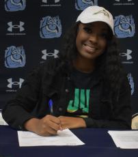 Asiana Britt  signed Wednesday to continue her basketball and academic pursuits at Jacksonville University. (Andy Diffenderfer, Tribune & Georgian)