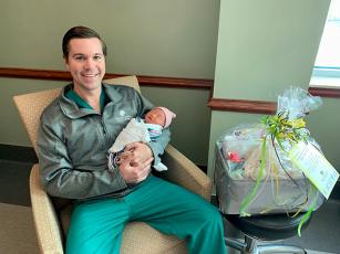 Southeast Georgia Physician Associates-Obstetrics & Gynecology’s Dr. Bradley W. Newton holds Jasper Jiang, Southeast Georgia Health System Camden Campus’ first baby of 2023.