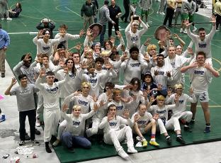 The Wildcats celebrate their ninth straight state duals crown and 10th overall. After topping North Gwinnett and Mill Creek last Saturday, Camden beat host Buford in the championship match. (Submitted photo)
