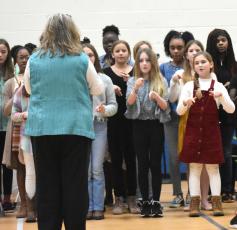 Woodbine Elementary School students perform a song Friday during the Thiokol Memorial Project’s 52nd anniversary of the deadly explosion at the Thiokol Chemical Factory.