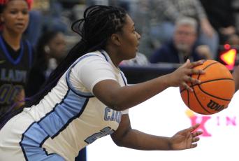 Tyana Glover looks upcourt for a teammate last Saturday. (Andy Diffenderfer, Tribune & Georgian)