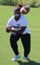 Jahria Fuller looks in a pass Monday in a Camden County flag football practice. (Andy Diffenderfer, Tribune & Georgian)