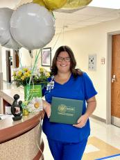 Registered nurse Leah Geedy receives The DAISY Award in recognition of the care and compassion she provides to patients at Southeast Georgia Health System. 