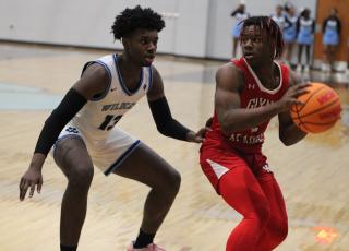 Antwann Brown (left, from an earlier game against Glynn Academy) paced four Wildcats in double figures last Friday, scoring 15 points as visiting Camden County routed Baker County. (Andy Diffenderfer, Tribune & Georgian)