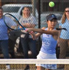 Maikayla Huynh plays a shot against Lowndes while partnering Olivia Farrell at No. 2 doubles. (Andy Diffenderfer, Tribune & Georgian)