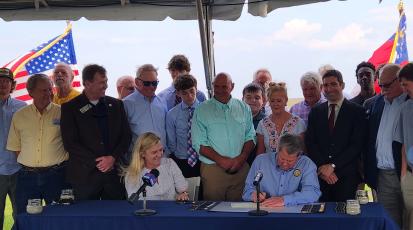 Gov. Brian Kemp signs a bill dubbing white shrimp as the official state crustacean.
