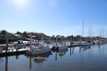 The new company charged with managing the Fernandina Harbor Marina has reversed course on increased prices for slips.