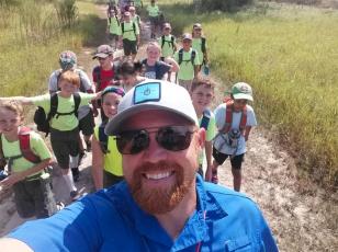 Marion County resident Steven Claytor leads Boy Scouts on an outdoor excursion recently as part of North Florida Survival and Adventure. Claytor teaches people how to survive in nature and prepare for emergencies.